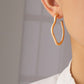 Irregular shape metal hoop earrings