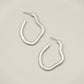 Irregular shape metal hoop earrings