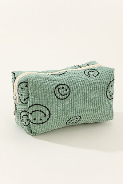 Embroidered smiley face pouch